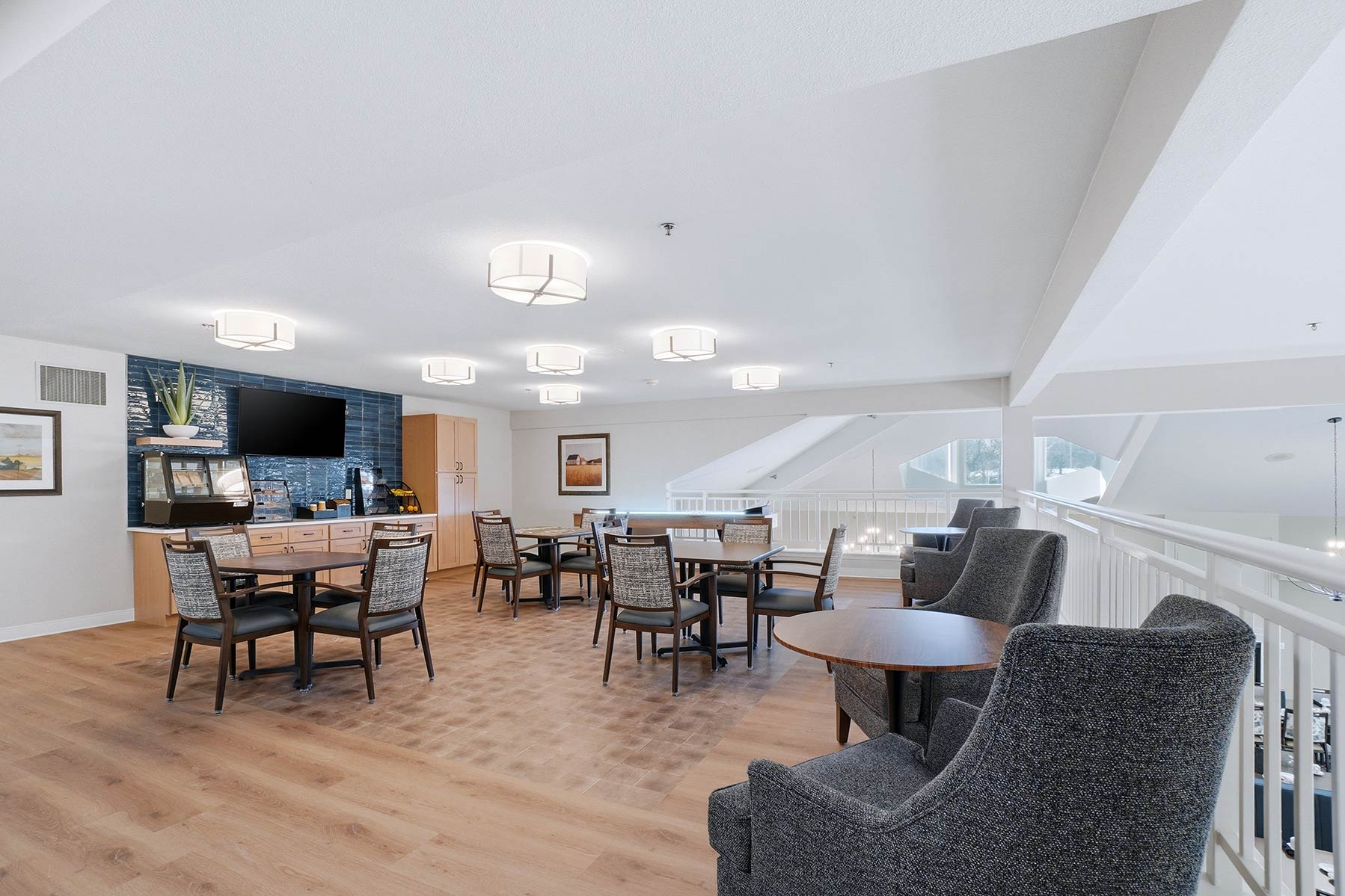 Bistro area at Mallard Point Senior Living, featuring subway tile backsplash and elegant touches with lots of comfortable seating, renovation completed in 2025.